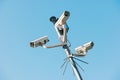 Security cctv surveillance cameras in front of blue sky concept for counter-terrorism, protesters, antiterrorism and protection
