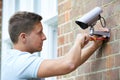 Security Consultant Fitting Security Camera To House Wall Royalty Free Stock Photo