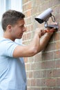 Security Consultant Fitting Security Camera To House Wall Royalty Free Stock Photo