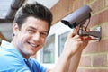 Security Consultant Fitting Security Camera To House Wall Royalty Free Stock Photo