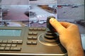 Security control room with keyboard and joystick to remove cameras