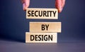 Security by design symbol. Concept words Security by design on wooden blocks on a beautiful grey table grey background. Royalty Free Stock Photo