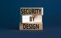 Security by design symbol. Concept words Security by design on wooden blocks on a beautiful grey table grey background. Business Royalty Free Stock Photo