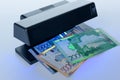 Security features on banknote in UV light protection