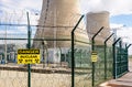 Security fence with danger warning signs of a nuclear power station Royalty Free Stock Photo