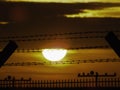 Security fence at sunset