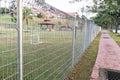 Security fencing at residential home to prevent trespassing Royalty Free Stock Photo