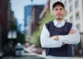 Security guard with arms folded against blurry street Royalty Free Stock Photo