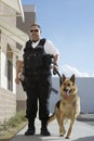 Security Guard With Dog On Patrol Royalty Free Stock Photo