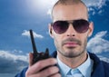 Security guard holding walkie talkie during sunny day Royalty Free Stock Photo