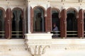 A security guard looks out of a window in the City Palace in Udaipur, India