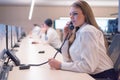 Security guard monitoring modern CCTV cameras in surveillance room. Female security guard in surveillance room. Female security