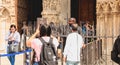 security guard monitors and informs tourists in front of Notre-Dame Cathedral in Paris, France Royalty Free Stock Photo