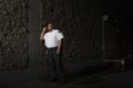 Security Guard Patrols At Night With Torch