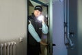 Security Guard Searching With Flashlight In Room Royalty Free Stock Photo
