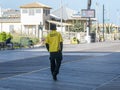 A security guard is seen from the back as he walks along the boardwalk in Atlantic City