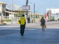 A security guard is seen from the back as he walks along the boardwalk in Atlantic City