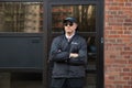 Security Guard Standing In Front Of The Entrance Royalty Free Stock Photo