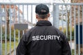 Security Guard Standing In Front Of Gate Royalty Free Stock Photo