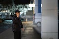 Security Guard Walking Building Perimeter Royalty Free Stock Photo