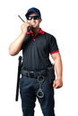 security guard wears dark glasses and wears a hat.holding a walkie-talkie with rubber batons ready and handcuffs on a tactical