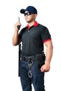 security guard wears dark glasses and wears a hat.holding a walkie-talkie with rubber batons ready and handcuffs on a tactical