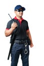 security guard wears dark glasses and wears a hat.holding a walkie-talkie with rubber batons ready and handcuffs on a tactical