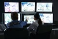 Security guards monitoring modern CCTV cameras in surveillance room Royalty Free Stock Photo