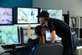 Security guards monitoring modern CCTV cameras in surveillance room Royalty Free Stock Photo