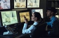 Security guards monitoring modern CCTV cameras in surveillance room Royalty Free Stock Photo