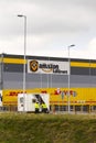 Security guards standing in front of Amazon logistics building on March 12, 2017 in Dobroviz, Czech republic. Royalty Free Stock Photo