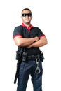 Security guards wearing black glasses.stand with arms crossed with rubber batons and handcuffs on tactical belts. on a isolated