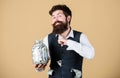 Security and money savings. Banking concept. Man bearded guy hold jar full of cash savings. Safe place to keep money Royalty Free Stock Photo