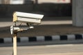 Security monitoring CCTV camera mounted on old pole Royalty Free Stock Photo