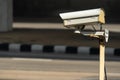 Security monitoring CCTV camera mounted on old pole Royalty Free Stock Photo