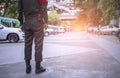 Security officers are facilitating traffic at the parking lot. Traffic officers are controlling traffic at the parking lot of the Royalty Free Stock Photo