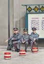 Security officers having a break on a bench, Guangzhou, China