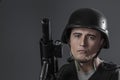 Security, paintball sport player wearing protective helmet aiming pistol ,black armor and machine gun Royalty Free Stock Photo