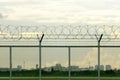 Security restricted area and a barbed wire fence