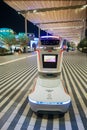 Security robot keeping order at exhibition. Machine ask to wear on face mask in EXPO 2020.