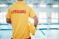 Security, safety or lifeguard by a swimming pool to help rescue the public from danger or drowning in water. Back view