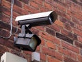 Security surveillance camera on a building corner Royalty Free Stock Photo