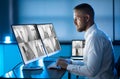 Security System Operator Looking At CCTV Footage At Desk Royalty Free Stock Photo