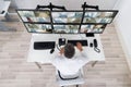 Security System Operator Looking At CCTV Footage At Desk Royalty Free Stock Photo