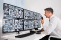 Security System Operator Looking At CCTV Footage Royalty Free Stock Photo