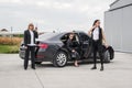 Security team of bodyguards protect celebrity vip in car limousine Royalty Free Stock Photo