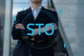 Security Token Offering STO cryptocurrency and blockchain concept, businessman pressing virtual graphics on virtual Royalty Free Stock Photo