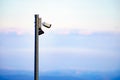 Security video camera against sky Royalty Free Stock Photo
