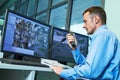 Security worker during monitoring. Video surveillance system. Royalty Free Stock Photo