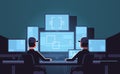 Security workers watching video surveillance camera on monitor in control monitoring safety center dark guard room flat